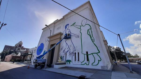 Mobile's Temple Downtown has been something of a blank canvas for the last 30 years; this image from December 2022 shows it being used as a slate for a temporary tape art mural in a project facilitated by the Mobile Arts Council. Now it's for sale, raising the potential it could see development as a commercial mixed-use space.