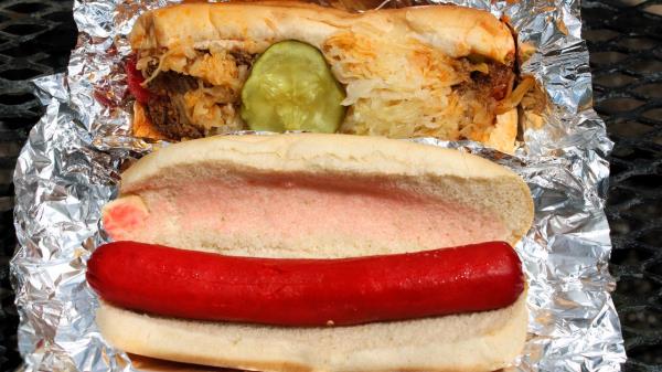 At top: A standard hot dog from Mobile's Dew Drop Inn, topped with chili and sauerkraut and other goodness. At bottom: It's true what they say a<em></em>bout Dew Drop dogs.