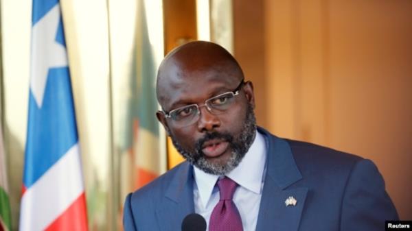 FILE - Liberia's President George Weah speaks at the Presidential palace during a visit to Abidjan, Ivory Coast, April 4, 2018. He co<em></em>nceded defeat Friday after provisio<em></em>nal results from this week's runoff vote showed challenger Joseph Boakai beating him.