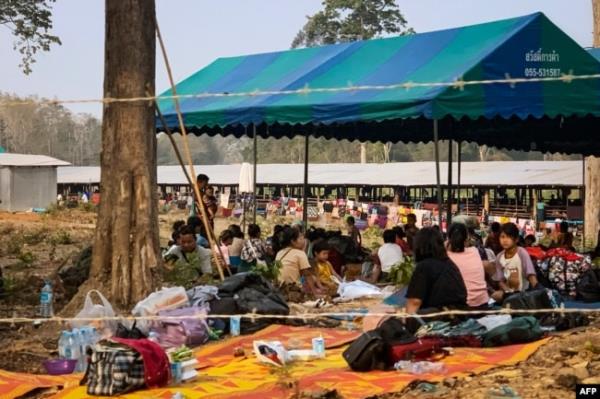 FILE - People fleeing fighting between the Myanmar military and ethnic rebel groups shelter on the Thai side of the Moei river in Mae Sot district in Tak province, April 7, 2023.