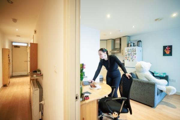 Ella in her flat in Manchester